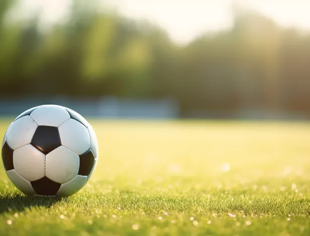 soccer-ball-foreground-with-blurred-field